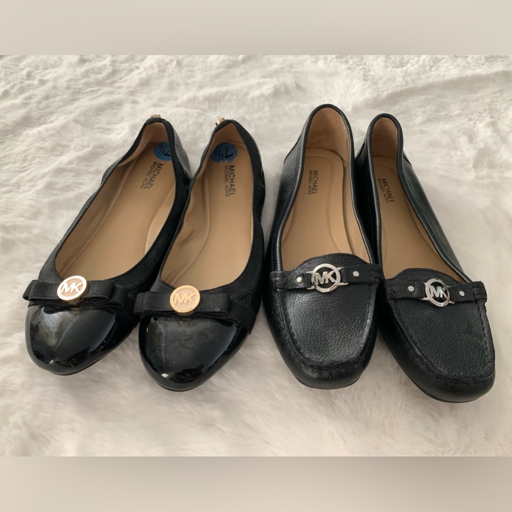 2 black Michael Kors flat shoes